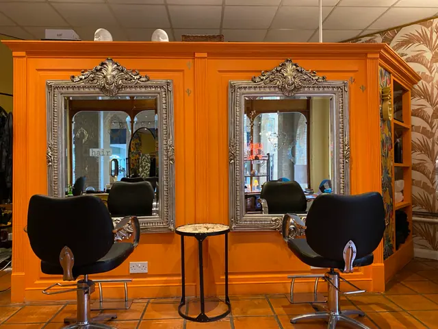 Hair Brighton orange styling wall with ornate mirrors and salon chairs